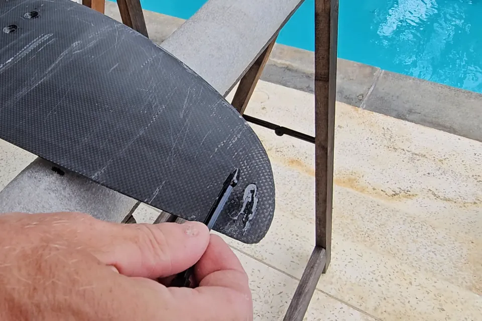 Chipped wing tip with exposed carbon